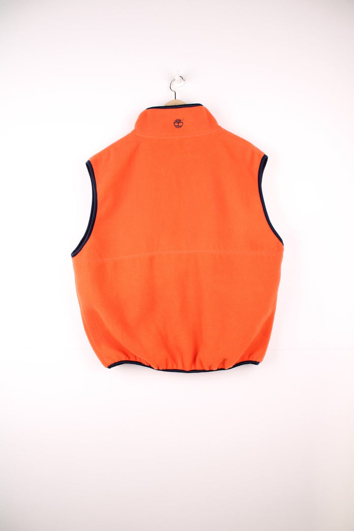 Orange Timberland zip-through fleece gilet with two side zip pockets and embroidered logo. 