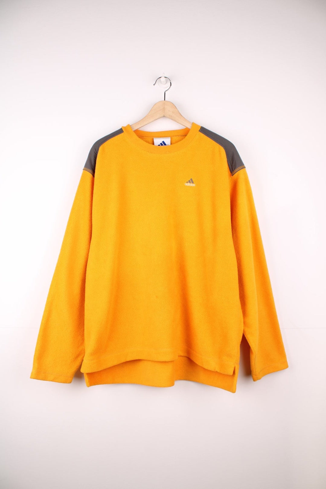 Yellow Adidas fleece crew-neck with grey accents and embroidered logo. 