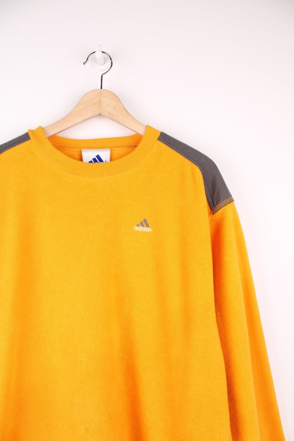 Yellow Adidas fleece crew-neck with grey accents and embroidered logo. 