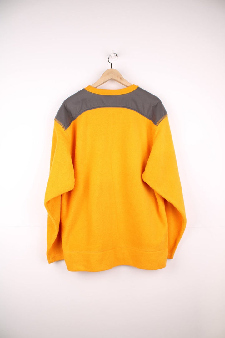 Yellow Adidas fleece crew-neck with grey accents and embroidered logo. 