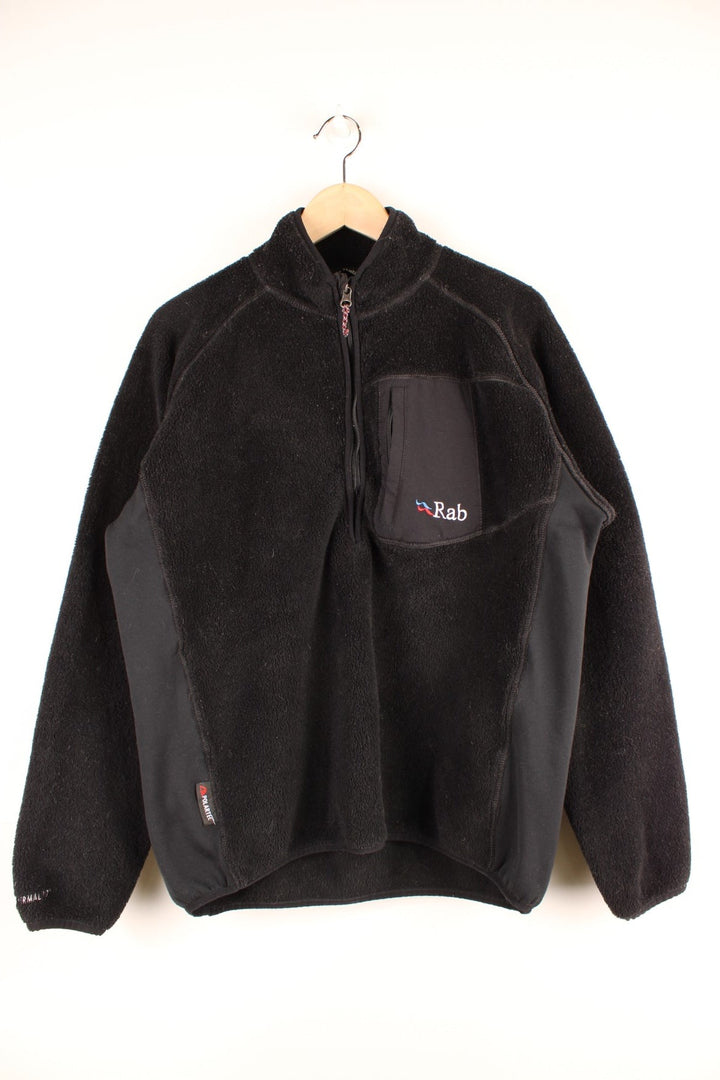 Black Rab Extreme 1/2 zip fleece with a zipped breast pocket and embroidered logos on the chest, hem and sleeve.  