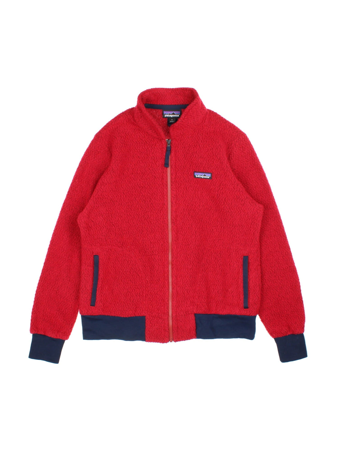 Patagonia Woolyester Fleece in a red colourway with a black trim, Full zip with side pockets and has small classic logo embroidered on the front.