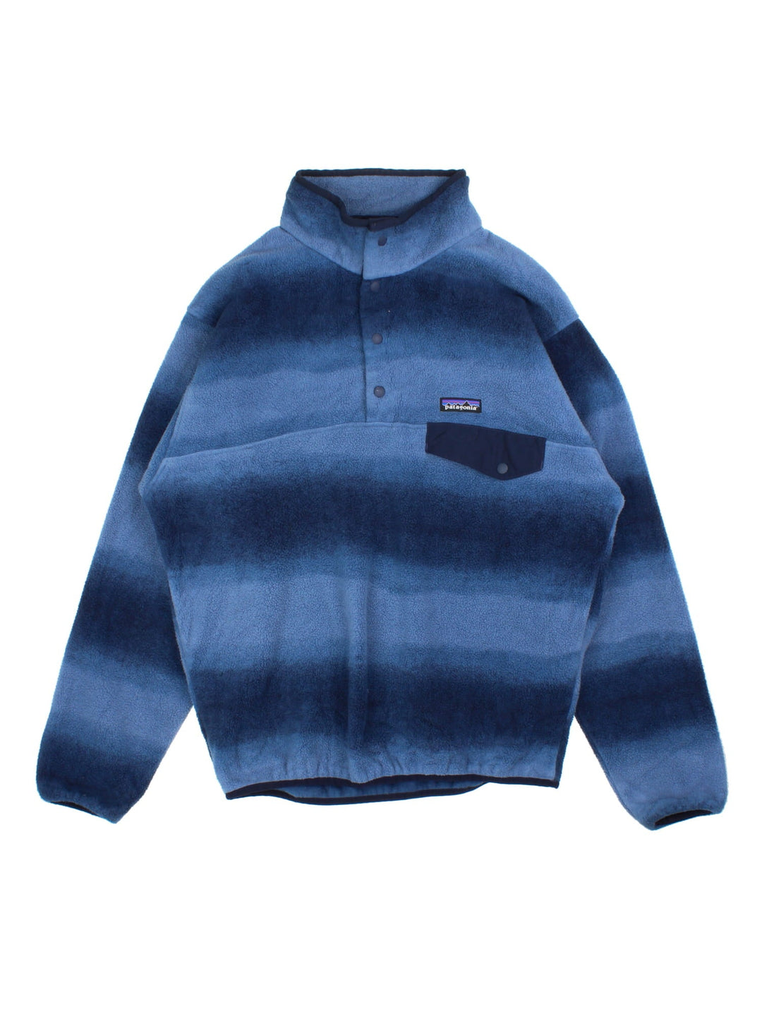 Vintage Patagonia Synchilla Fleece in a blue colourway.1/4 Button up with buttoned pocket and small classic logo on the front. Blue multitone pattern across the whole fleece.