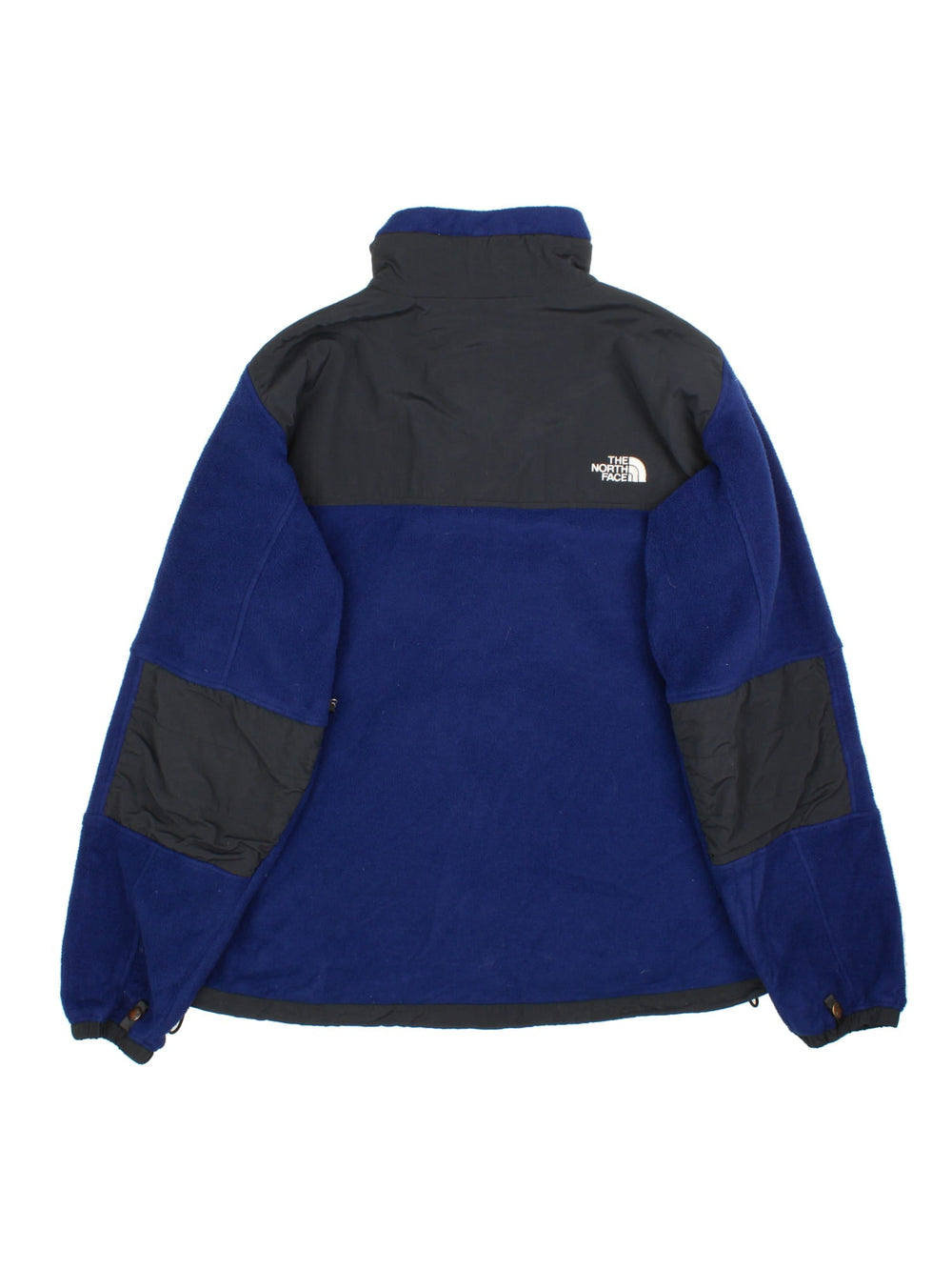 The North Face Denali Fleece in a blue & black colourway. Full zip with multiple pockets on the sides and under arms. Drawstring hem, elbow patches and classic small logo on the front and back.