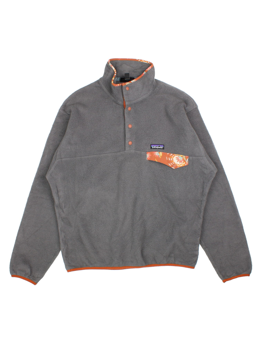 Patagonia Synchilla Fleece in a grey colourway with orange trimming. 1/4 Buttons up and has button pocket on the front with the small classic logo above. 