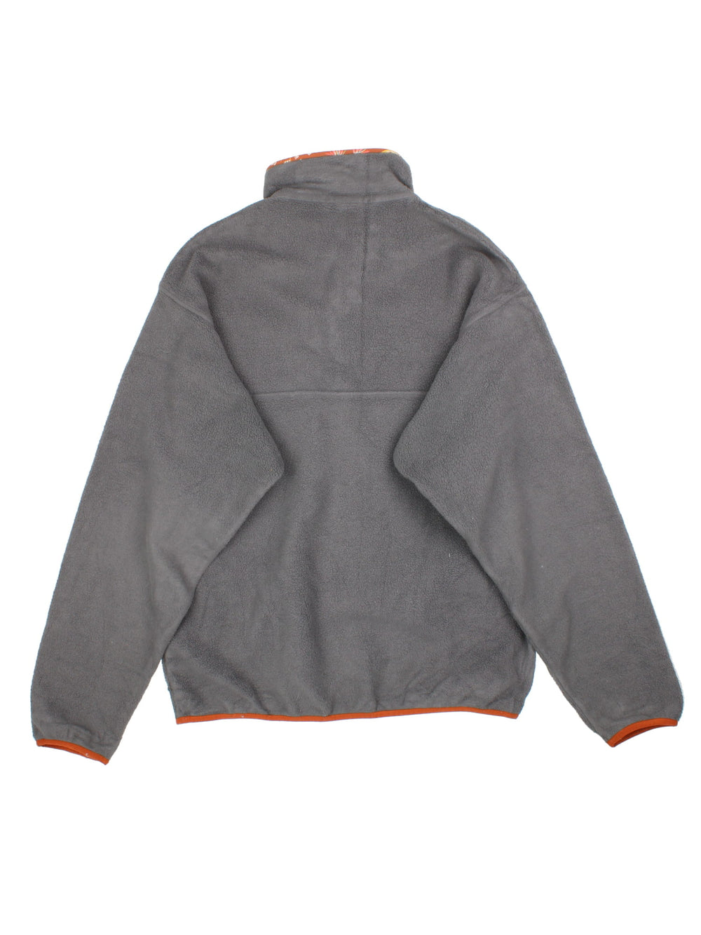 Patagonia Synchilla Fleece in a grey colourway with orange trimming. 1/4 Buttons up and has button pocket on the front with the small classic logo above. 