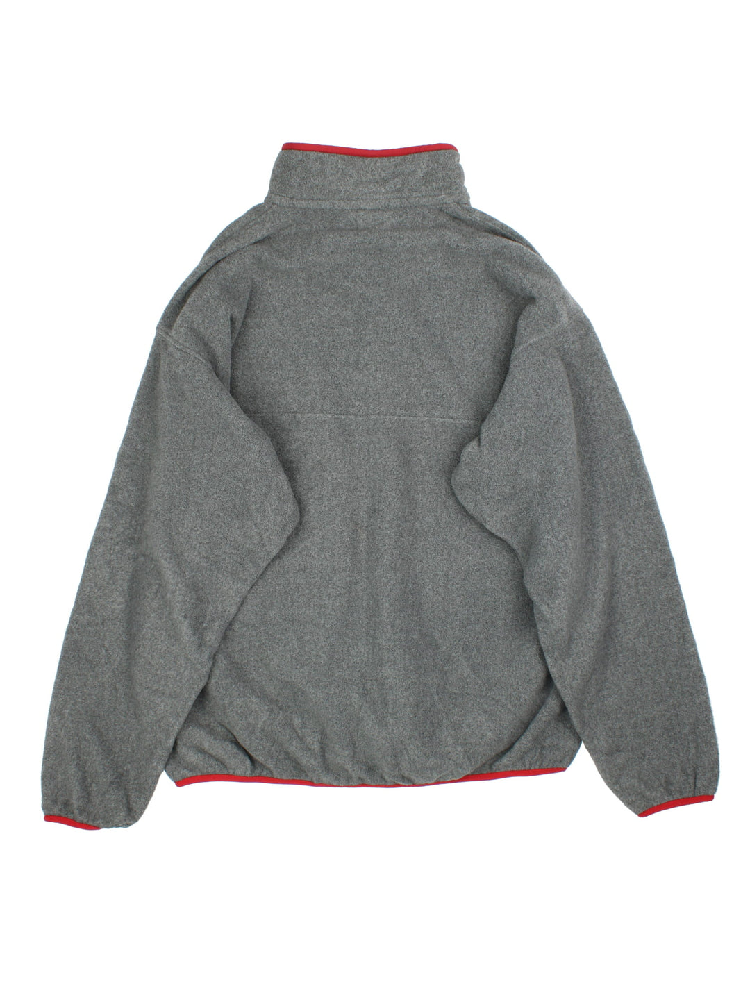 Patagonia Synchilla Fleece in a grey colourway with red trimming. 1/4 Buttons up and has button pocket on the front with the small classic logo above. 