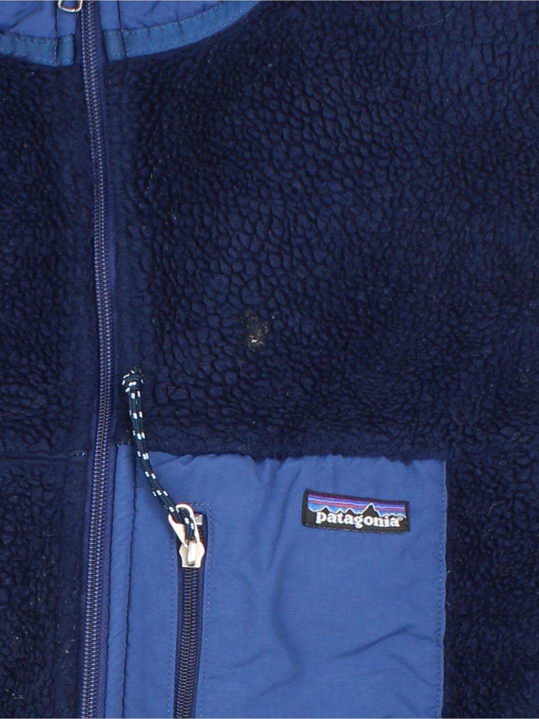 Patagonia Fleece Gilet in a blue colourway. Full zip with multiple zip pockets and small classic logo on the front.