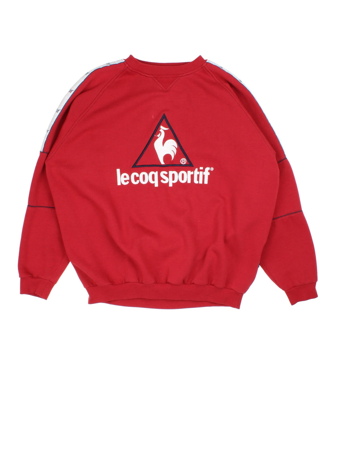 Vintage Le Coq Sportif Sweatshirt in a red colourway with large logo across the chest and stripe panelling with logo down the shoulder/sleeve.