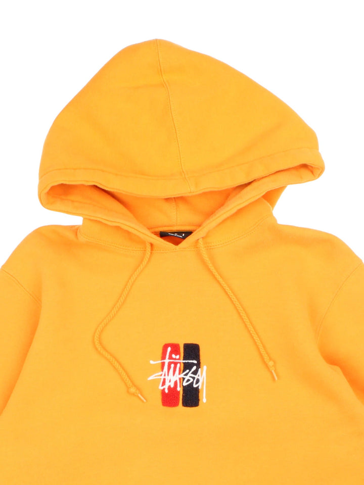 Stussy Hoodie in a yellow colourway with box logo on the front and standard double pocket.