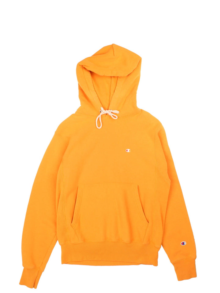 Champion Hoodie in a orange colourway with small classic logo on the front and sleeve.