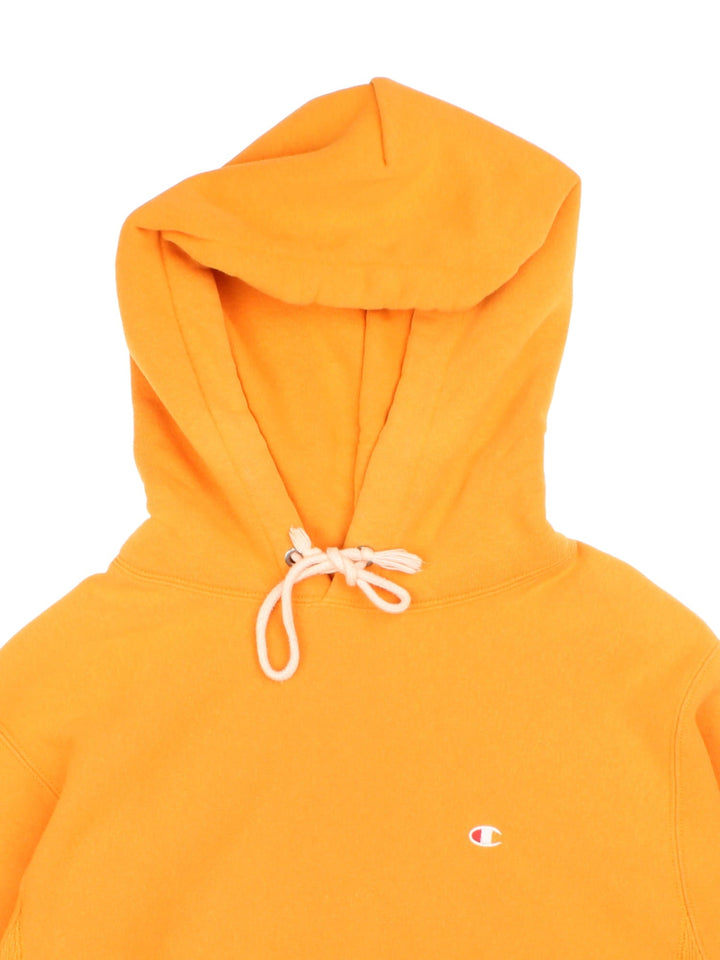 Champion Hoodie in a yellow colourway with small classic logo on the front and sleeve.