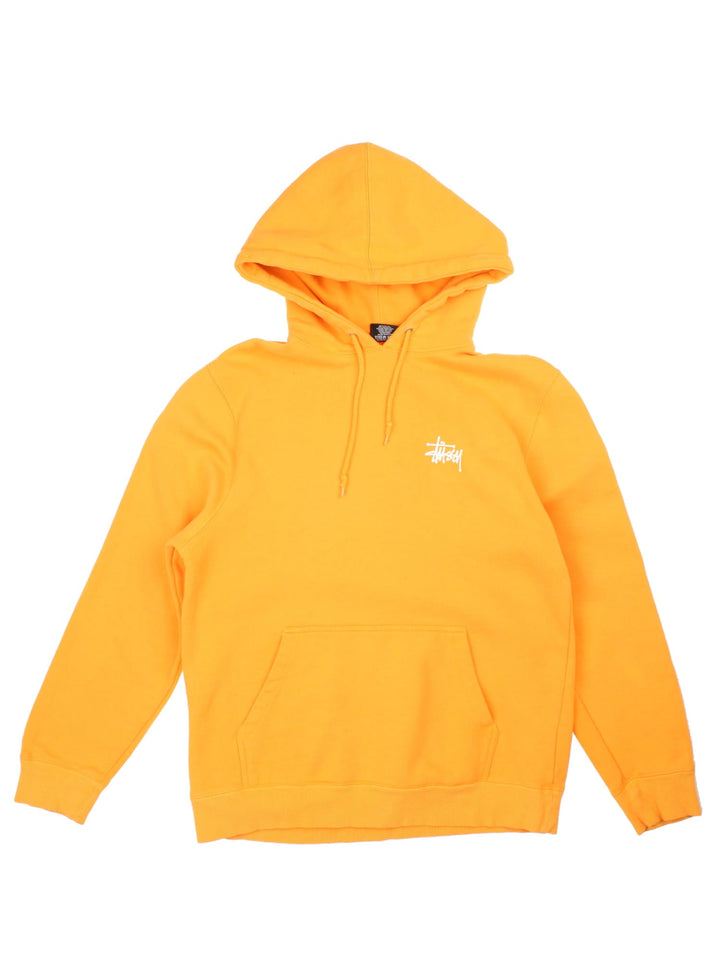 Stussy Hoodie in a orange colourway with classic small logo on the front and large logo graphic on the back.