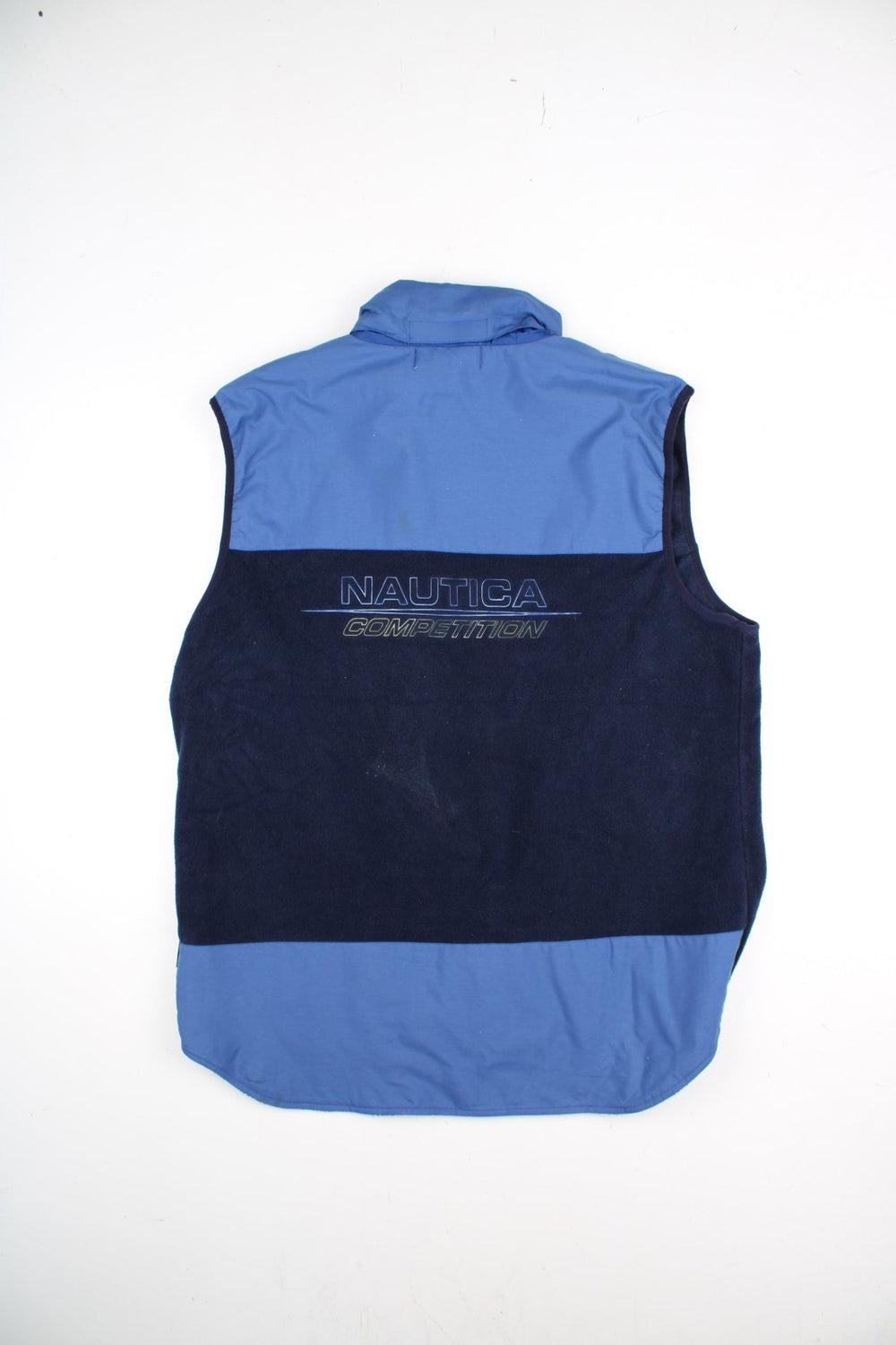 Nautica Competition Fleece Vest in a blue colourway. Zips up and a front chest pocket, hidden hood, and has the logo embroidered on the front and back.