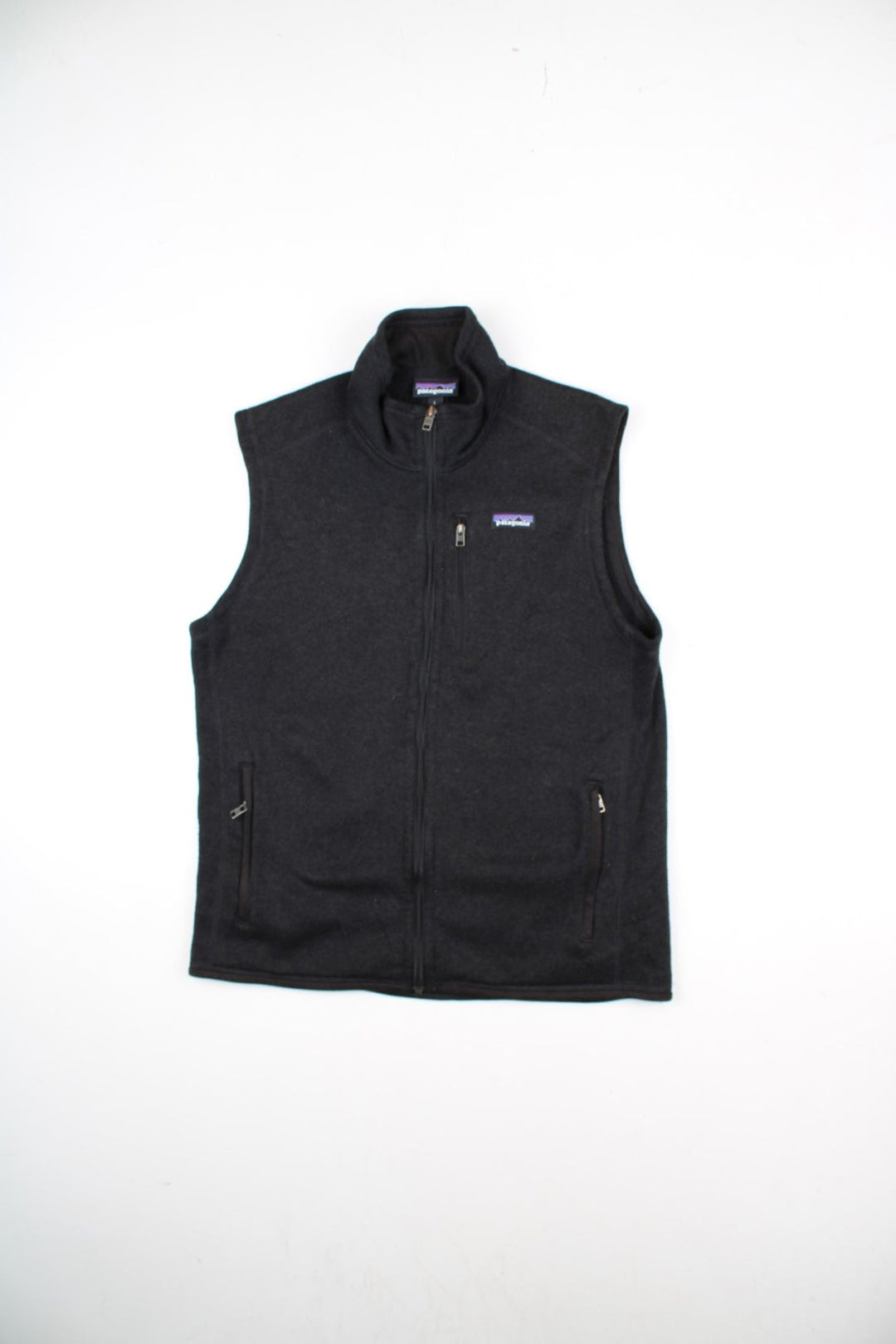 Patagonia Fleece Vest in a black colourway. Zips up and has multiple pockets, and the logo embroidered on the front.