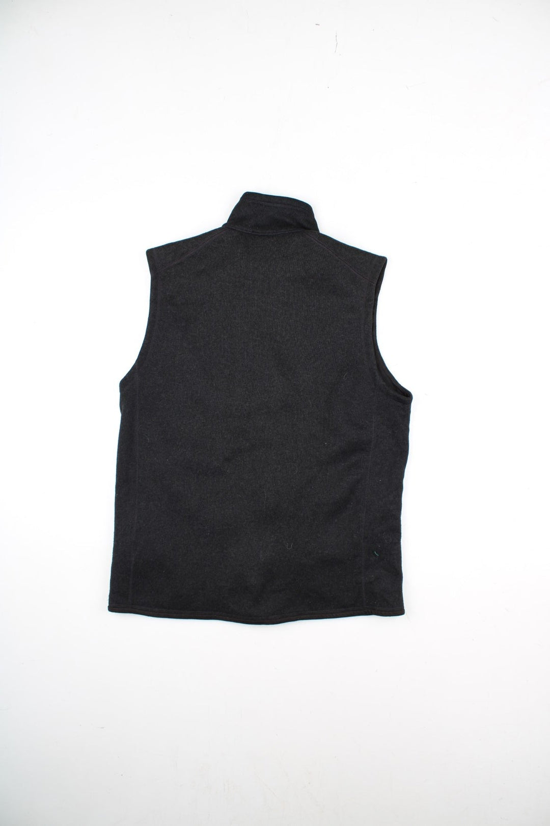 Patagonia Fleece Vest in a black colourway. Zips up and has multiple pockets, and the logo embroidered on the front.