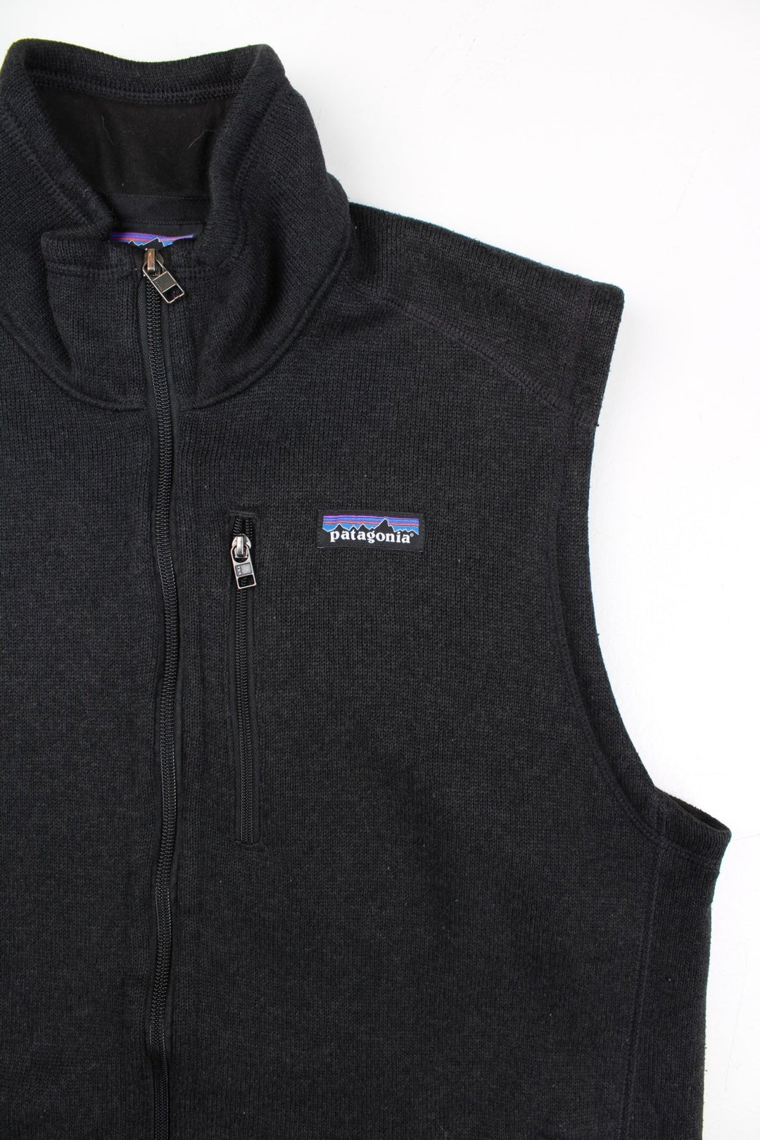 Patagonia Fleece Vest in a black colourway. Zips up and has multiple pockets, and the logo embroidered on the front.