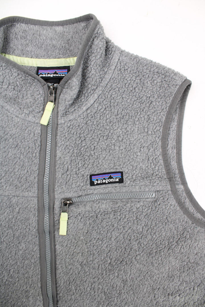 Patagonia Fleece Vest in a grey colourway. Zips up and has multiple pockets, and the logo embroidered on the front.