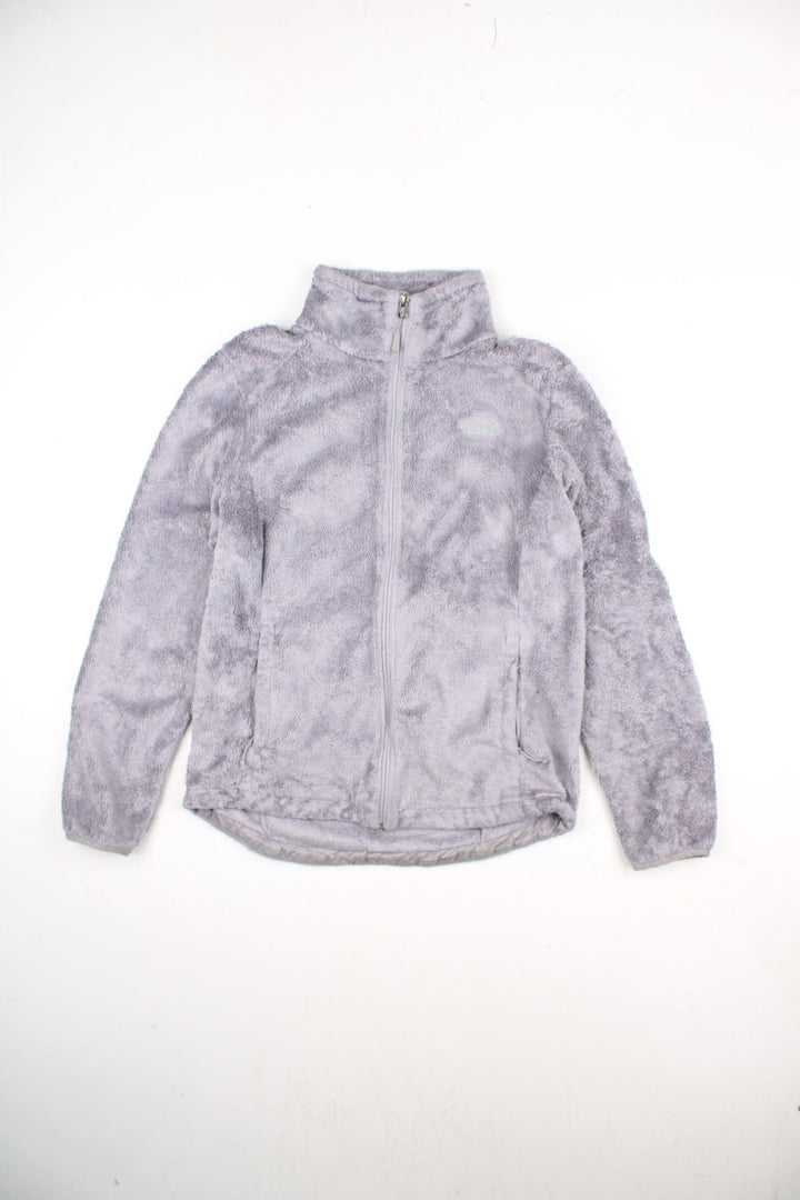 The North Face Osito Fleece in a grey colourway. Zips up and has side pockets, and the logo embroidered on the front and back.