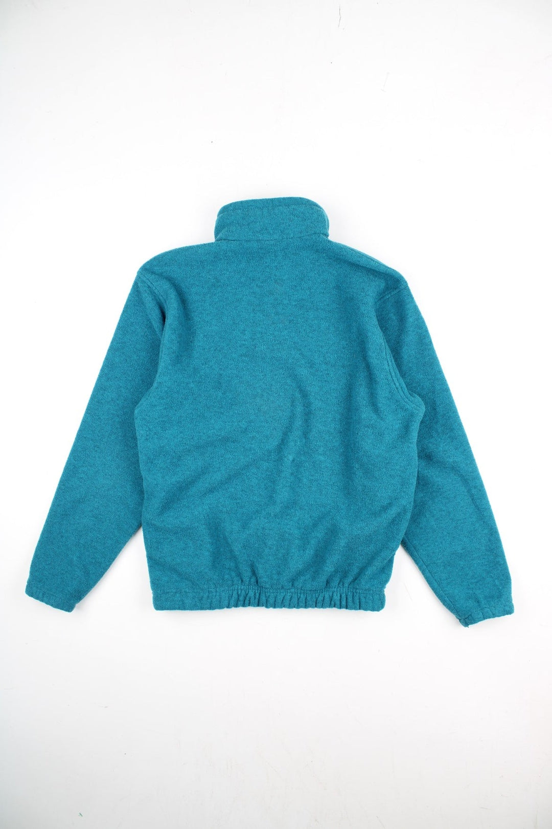 Vintage Lowe Alpine Pullover Fleece in a blue colourway. Half zip up and has side pockets, and the logo embroidered on the front.