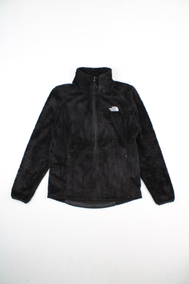 The North Face Osito Fleece in a black colourway. Zips up and has side pockets, and the logo embroidered on the front and back.