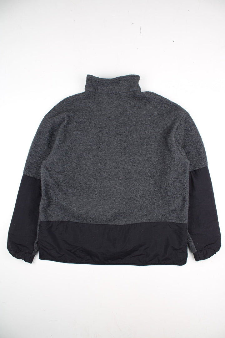 Vintage Ralph Lauren Polo Sport Fleece in a grey colourway with black panels on the sleeves and on the back. 1/4 zip up and has a chest pocket, and the logo embroidered on the front.