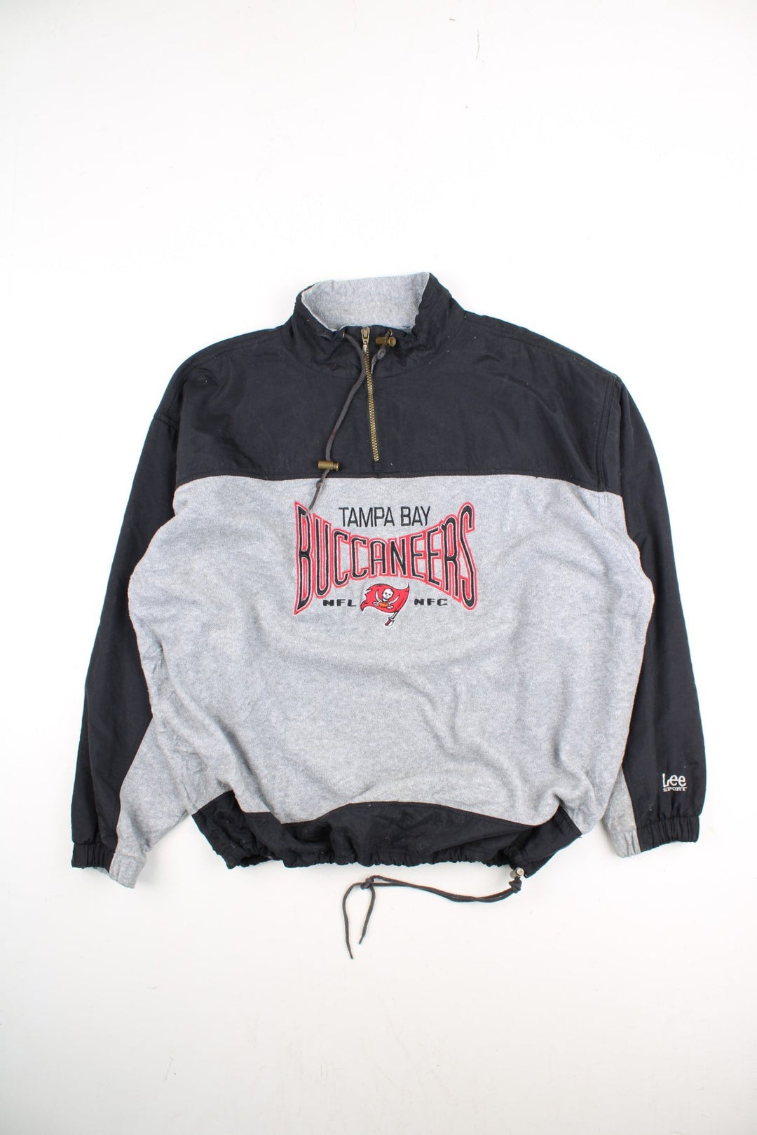 Vintage Lee Sport Tampa Bay Buccaneers NFL Fleece in a grey and black colourway. 1/4 zip up with drawstring collar, and has the logo embroidered on the front.