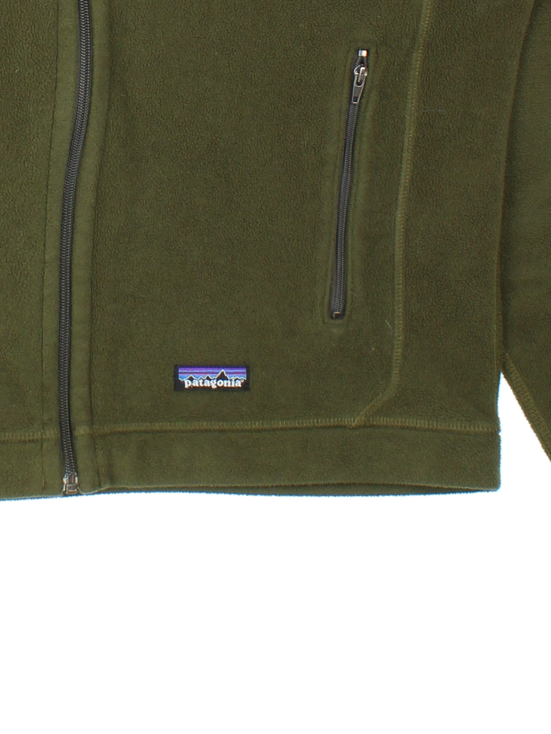 Patagonia Fleece Jacket in a green colourway. Full zip and double pocket on the front. Embroidered classic logo badge on the front at the bottom.