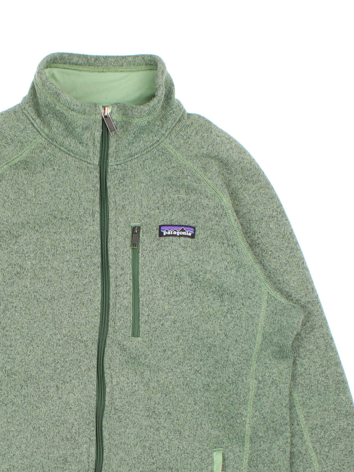 Patagonia Fleece Jacket in a green colourway. Multiple pockets on front and small classic logo on chest.