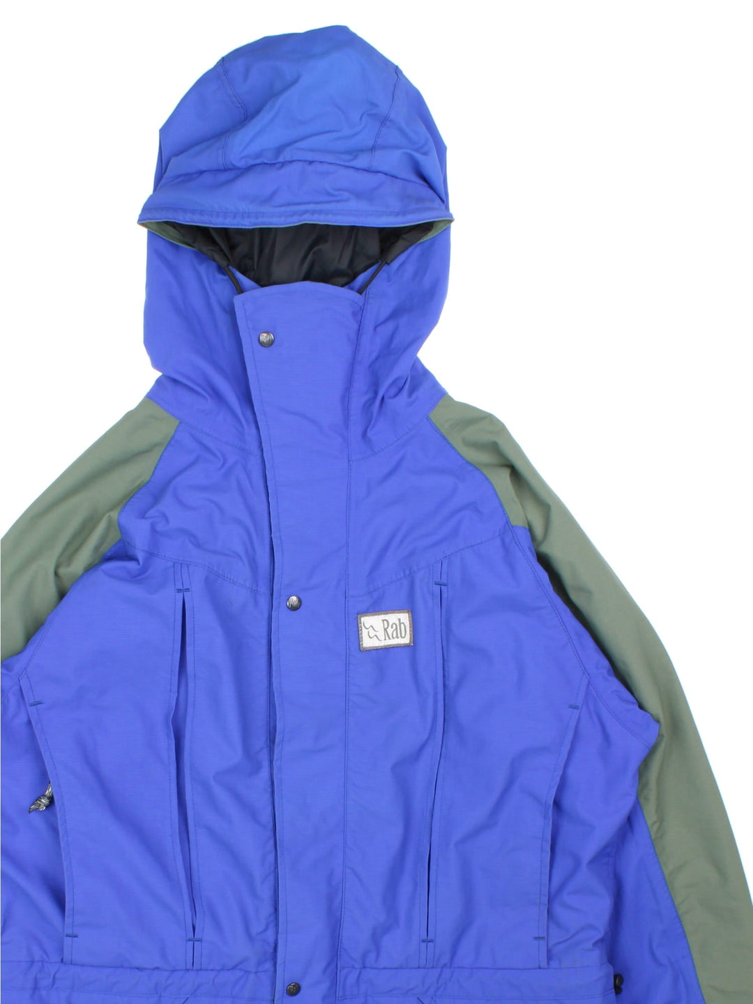 Vintage Rab Heavy Jacket in a blue colourway. Multiple pockets with zips and drawstring at the hip, Green panelling down shoulders and arms.