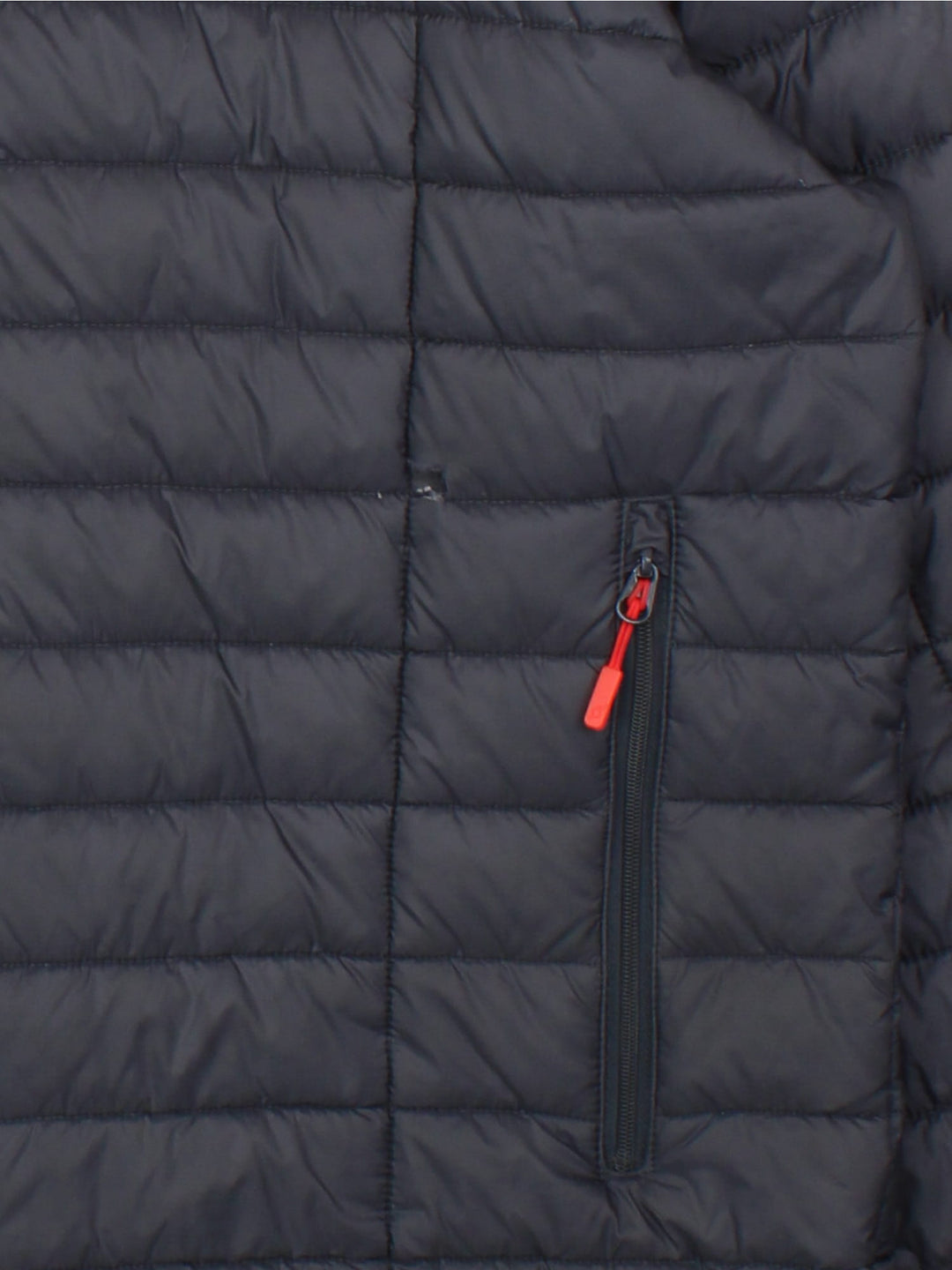 Rab Nebula Puffer Coat in a black colourway. Full red zip detail and multiple pockets on front with a drawstring hood.