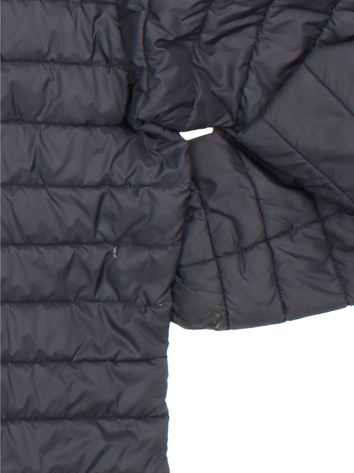 Rab Nebula Puffer Coat in a black colourway. Full red zip detail and multiple pockets on front with a drawstring hood.