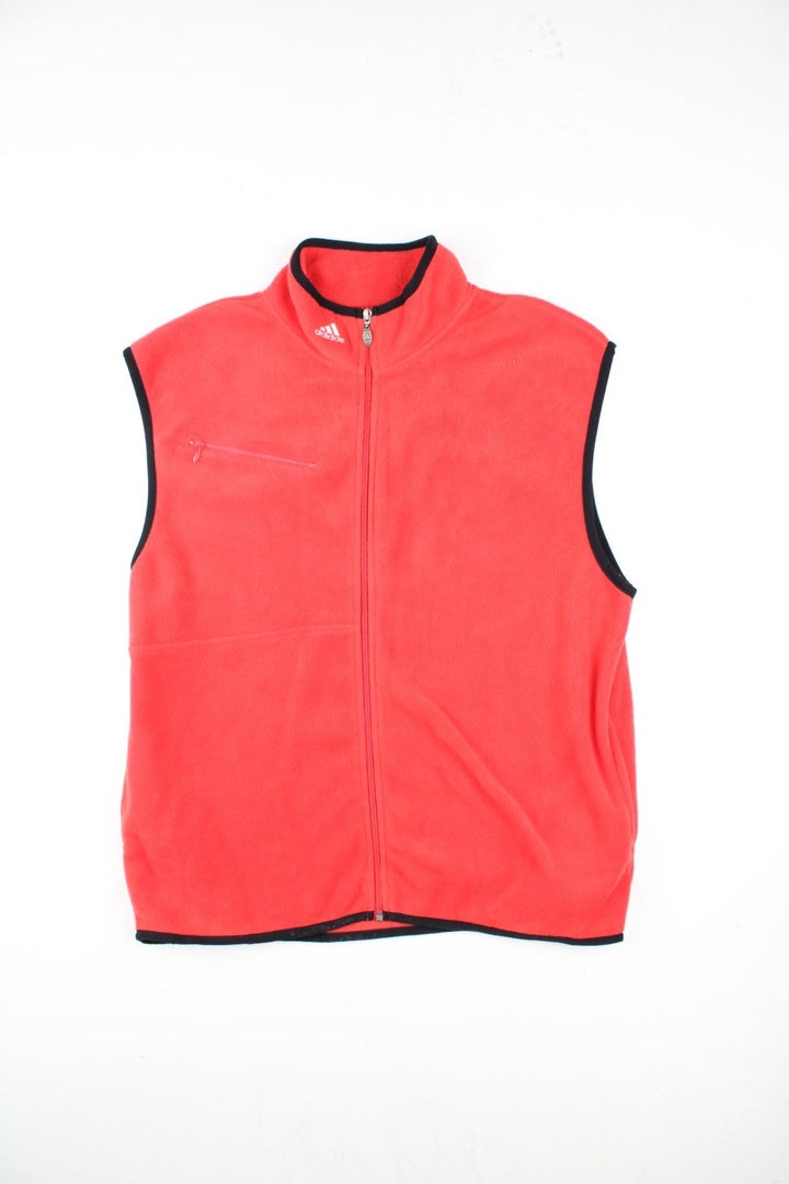 Vintage Adidas Fleece Vest in a red colourway, with black piping. Zip up with side pockets, and has the logo embroidered on the neckline.