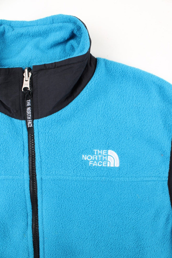 Vintage The North Face Gilet in a blue/black colourway. Zip up with side zip pockets, logo embroidered on front.