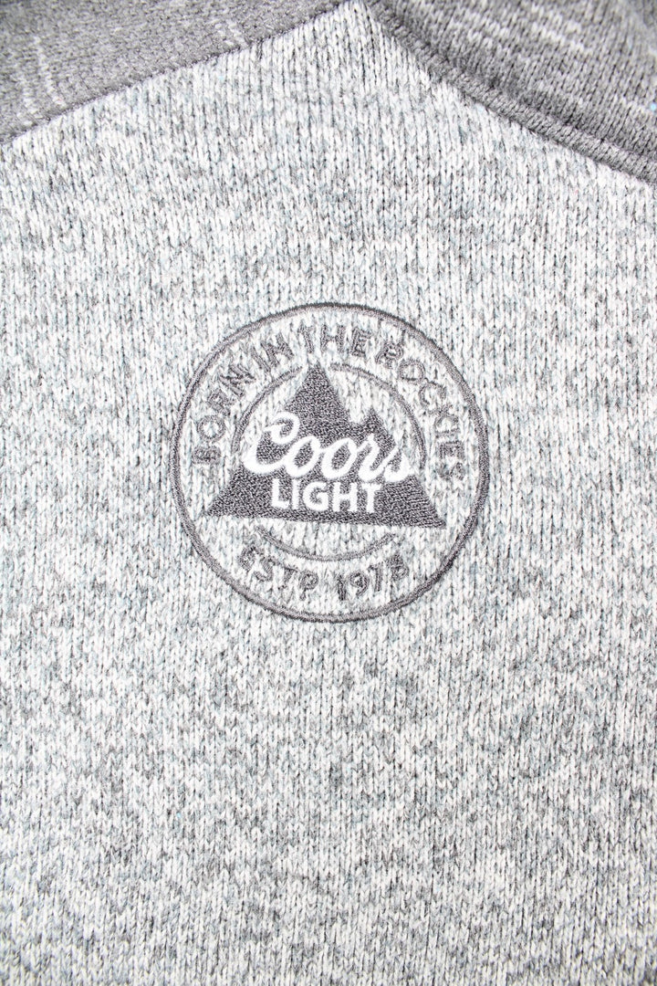 Vintage Patagonia x Coors Light 1/4 Zip Sweater in a grey colourway. Front zip pocket, embroided branding patch and Coors Light logo.