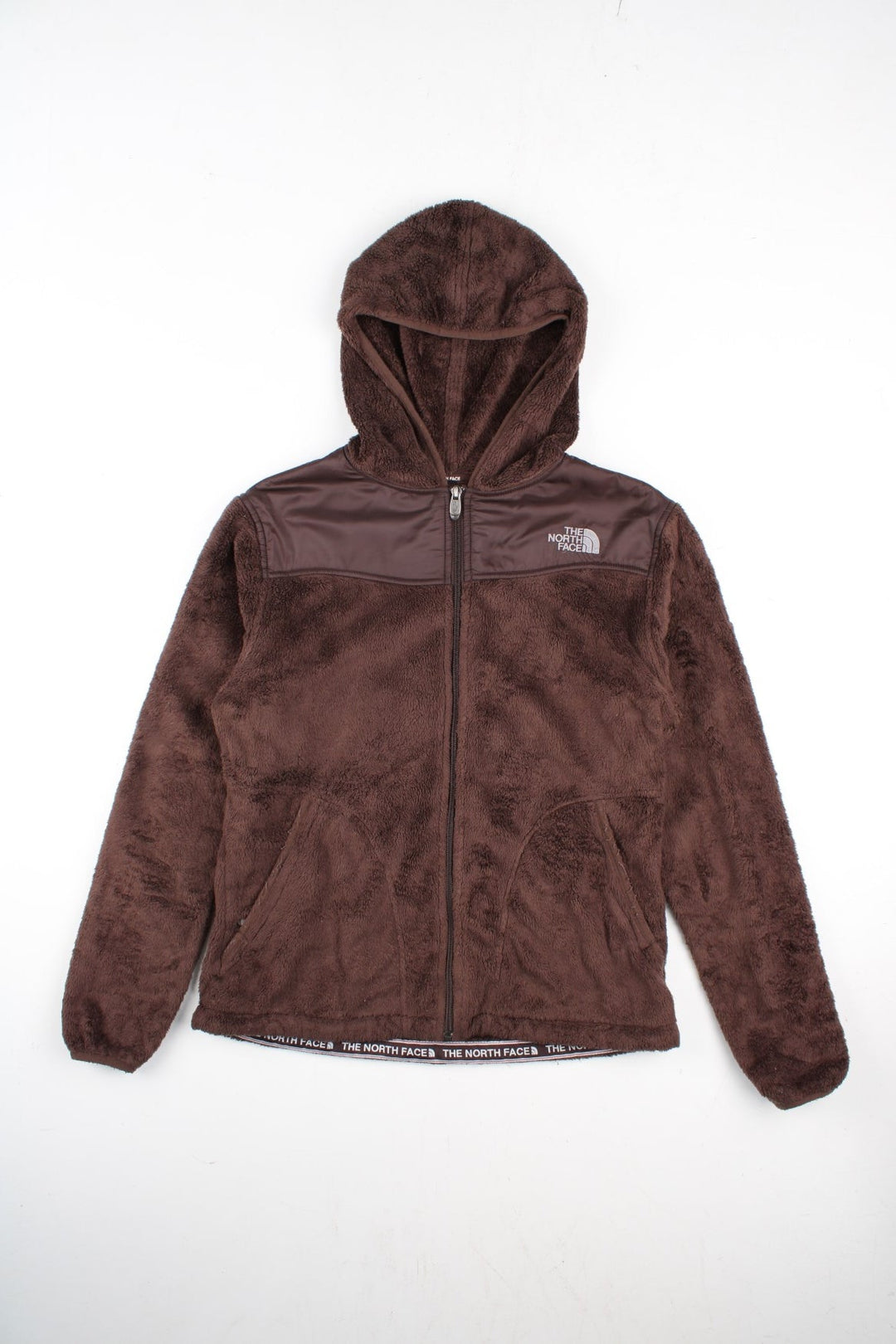 The North Face Fleece in a brown colourway. Zip up fastening with side zip pockets, hood and branding embroidered on front/back.