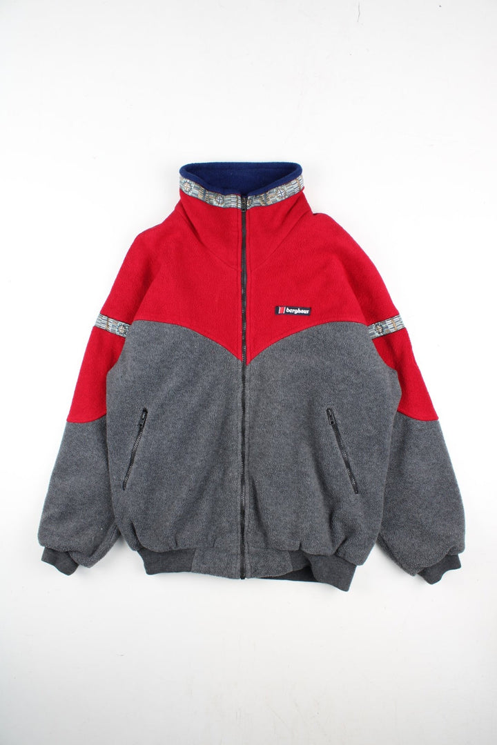 Vintage 90's Berghaus Windstopper Fleece in a red/grey colourway. Zip up fastening with zip side pockets, wind stopper lining, aztec trim detailing and branding embroidered on front.