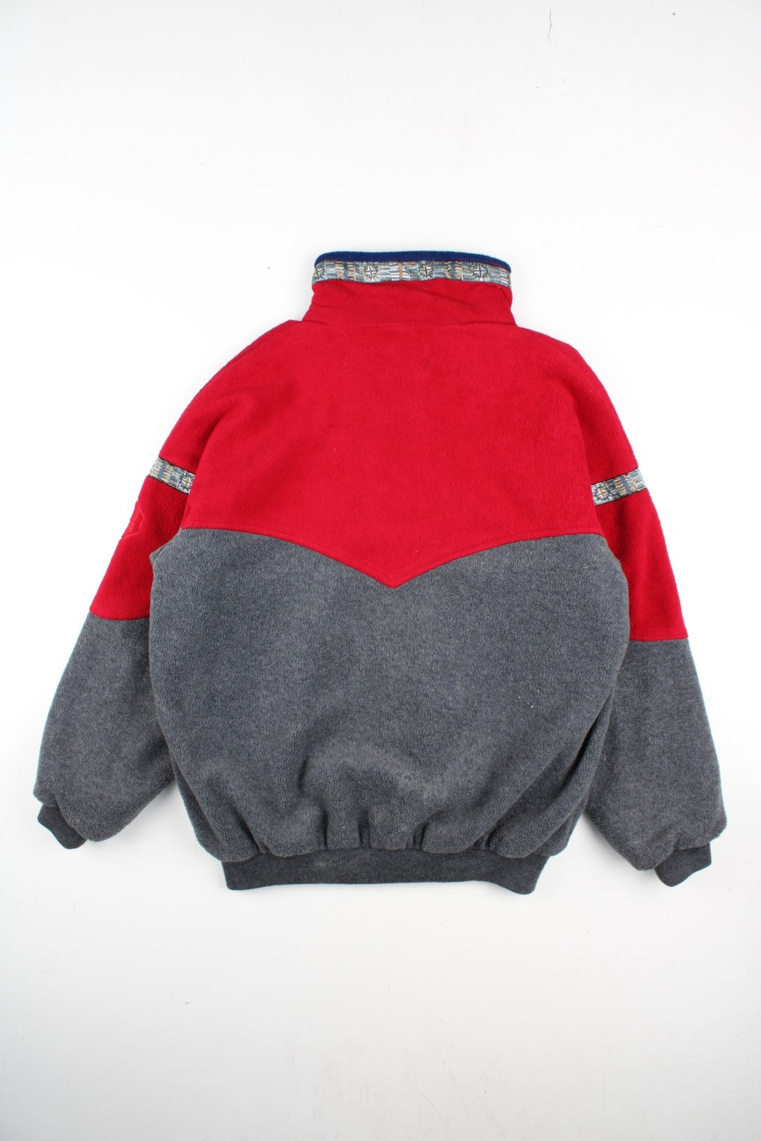 Vintage 90's Berghaus Windstopper Fleece in a red/grey colourway. Zip up fastening with zip side pockets, wind stopper lining, aztec trim detailing and branding embroidered on front.