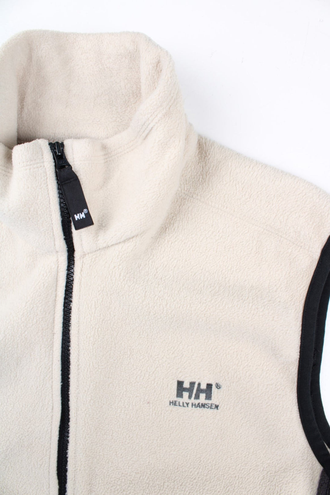 Vintage Helly Hansen Fleece Gilet in a white/black colourway. Zip up fastening with side zip pockets, branding embroidered on front and back.