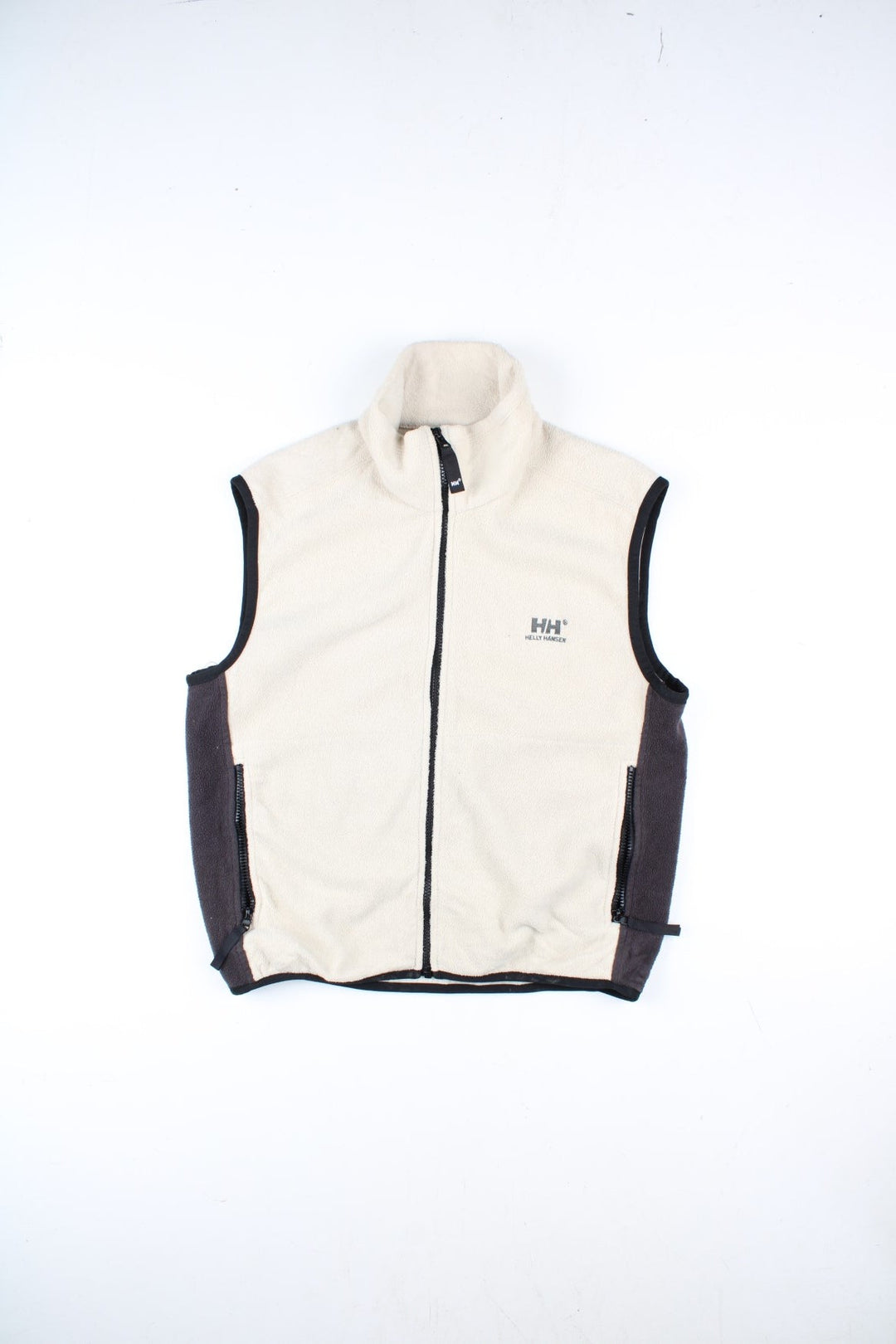 Vintage Helly Hansen Fleece Gilet in a white/black colourway. Zip up fastening with side zip pockets, branding embroidered on front and back.