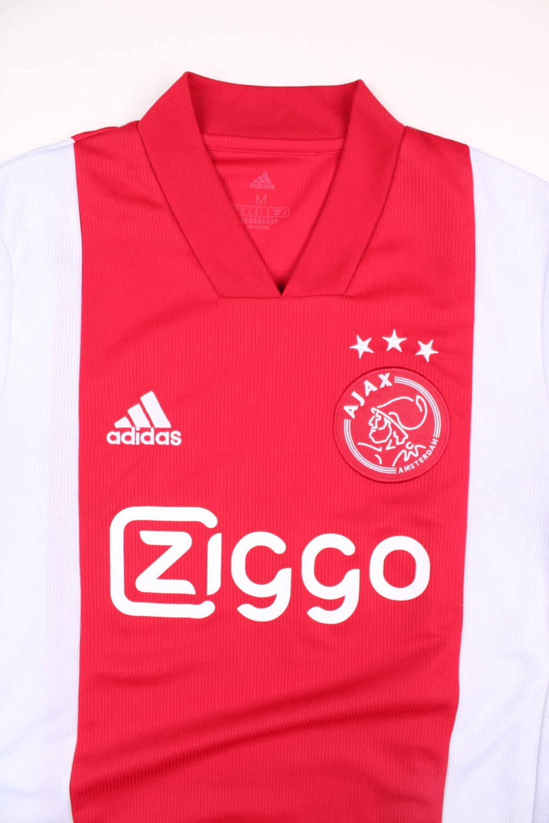 Ajax 2020/21 Adidas Football Shirt in the red and white home kit colourway, features embroidered logos and badge on the front.