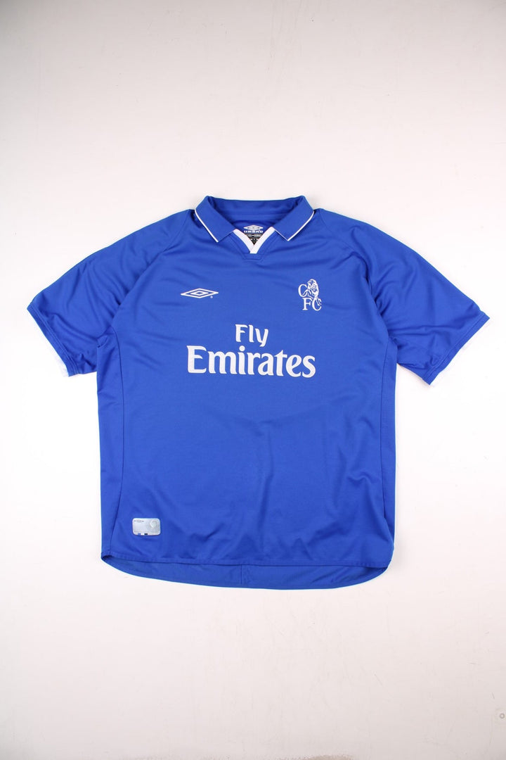 Chelsea 2001/03 Umbro Football Shirt in the blue home kit colourway, features embroidered logos and badge on the front.