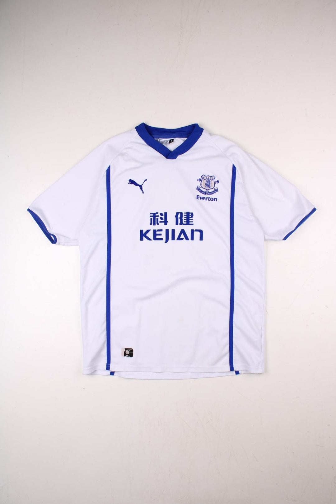 Everton 2002/03 Puma Football Shirt in the grey away kit colourway, features embroidered logos and badge on the front.