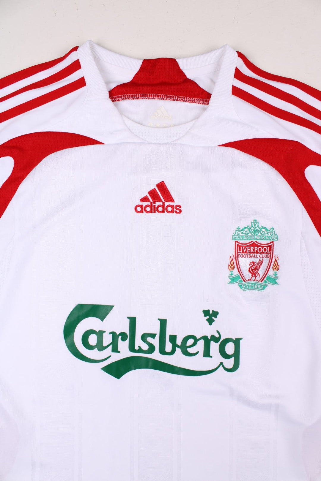 Liverpool 2007/08 Adidas Football Shirt in the white away kit colourway, features embroidered logos and badge on the front.