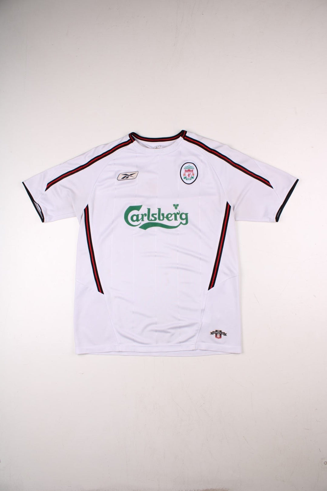 Liverpool 2003/05 Reebok Football Shirt in the white away kit colourway, features embroidered logos and badge on the front.