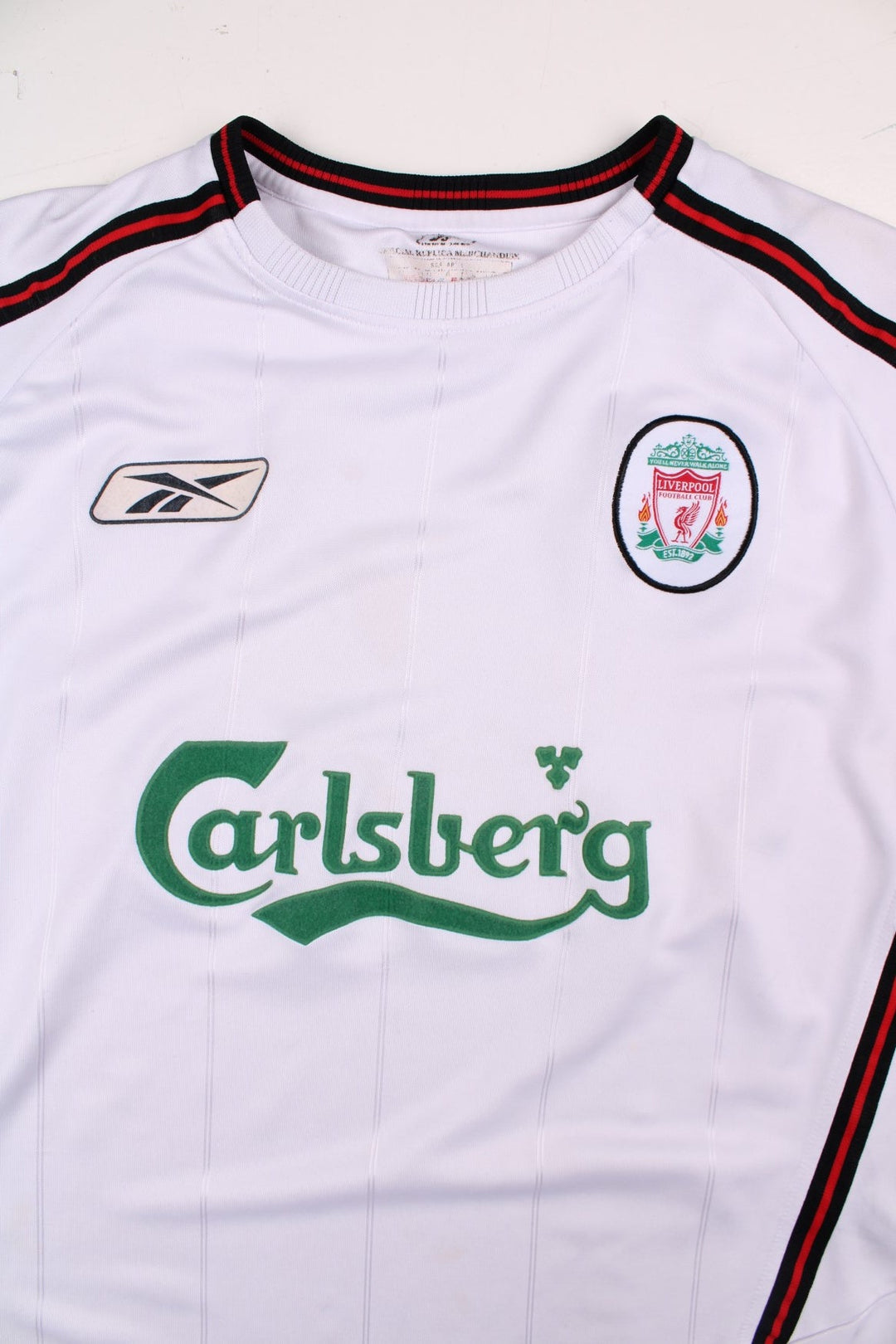 Liverpool 2003/05 Reebok Football Shirt in the white away kit colourway, features embroidered logos and badge on the front.