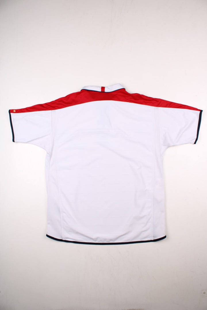 England 2004/06 Umbro Football Shirt in the white home kit colourway, features embroidered logos and badge on the front with reversible option.