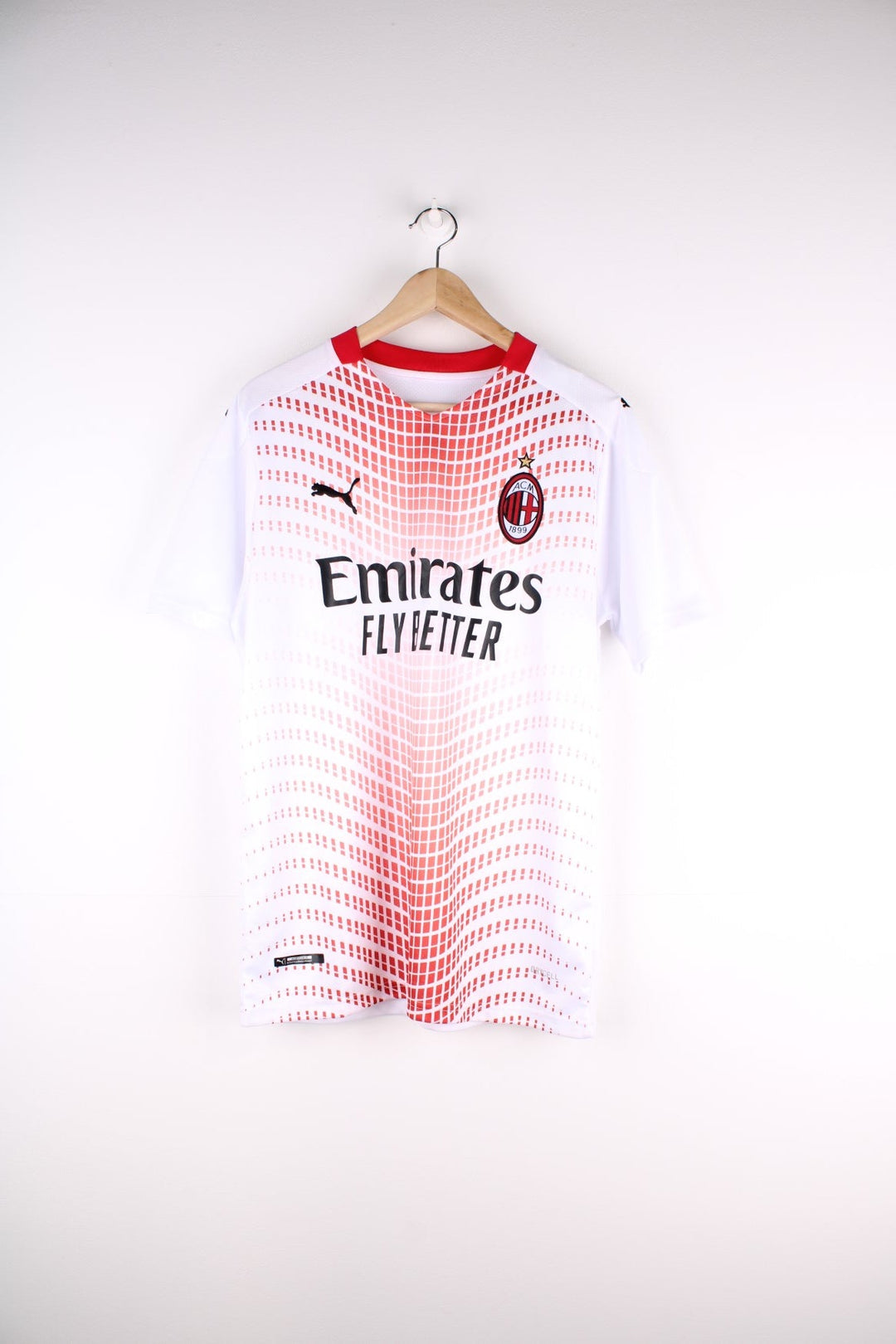 AC Milan 2020/21 Puma Away Football Shirt in the a white and red colourway, features embroidered logo and badge on the front.