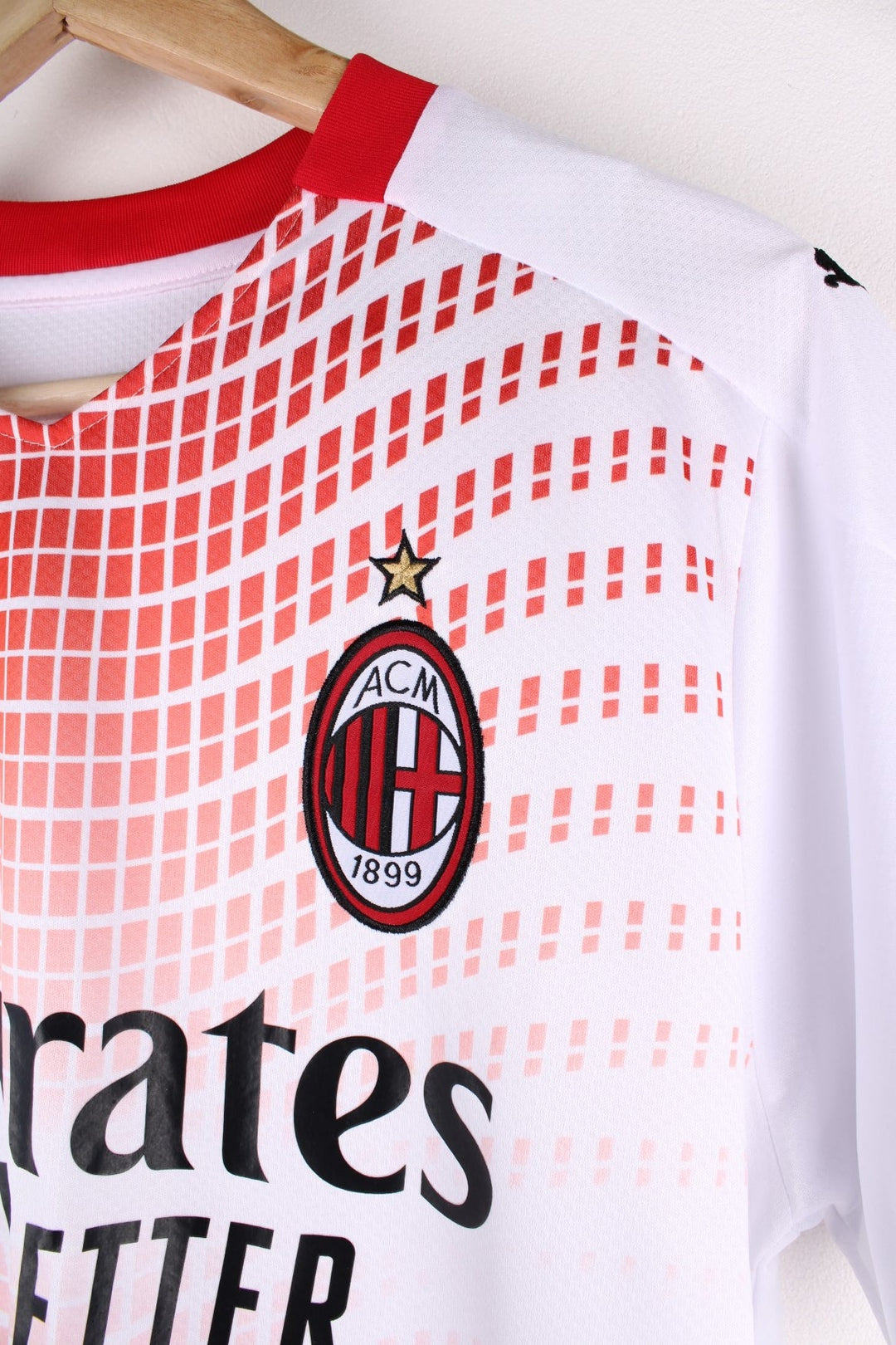 AC Milan 2020/21 Puma Away Football Shirt in the a white and red colourway, features embroidered logos and badge on the front.