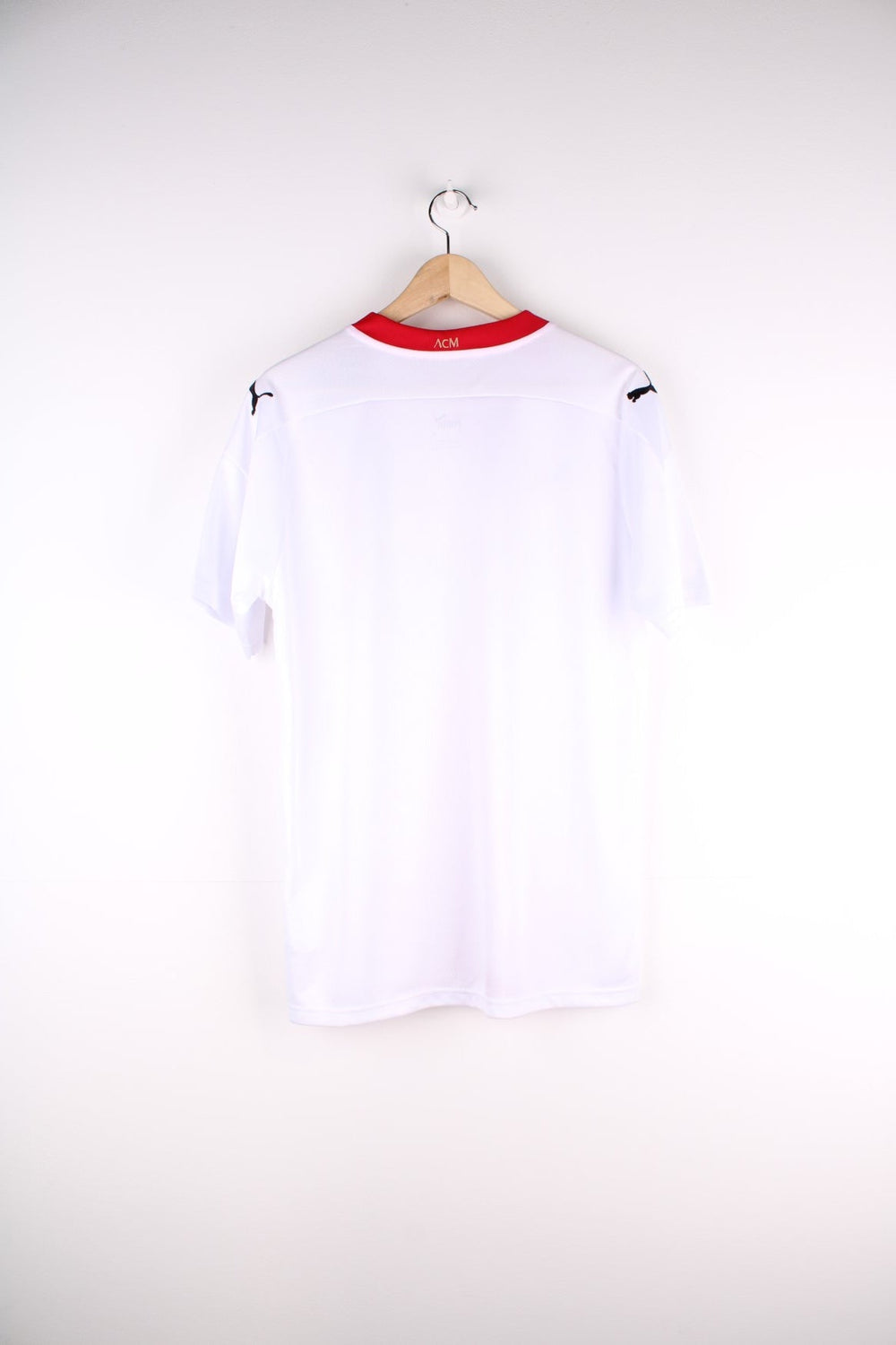 AC Milan 2020/21 Puma Away Football Shirt in the a white and red colourway, features embroidered logos and badge on the front.